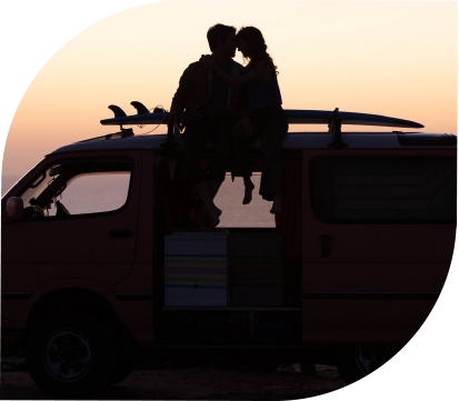Couple On Bus With Sunsetting